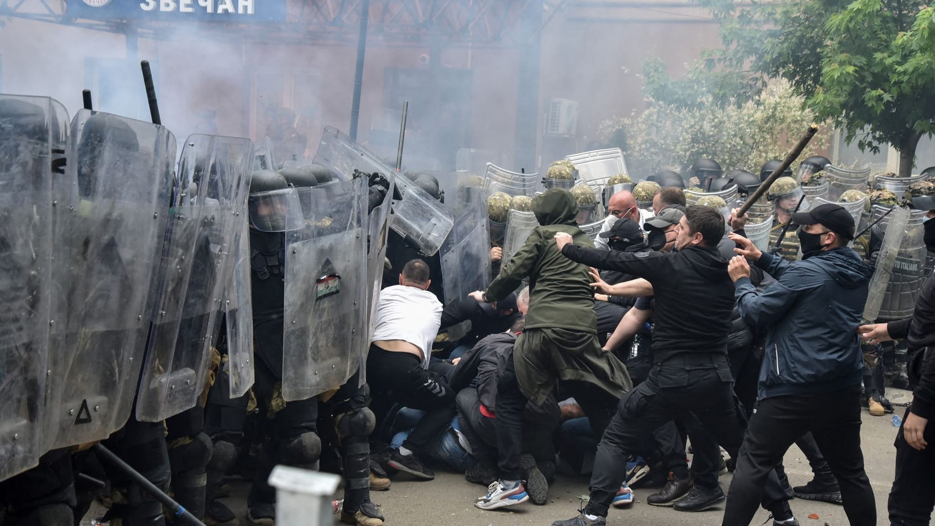 NATO Kosovo Force (KFOR) soldiers clash with local Kosovo Serb protesters in the town of Zvecan