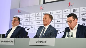 Axel Hellmann (l.) neben Hans-Joachim Watzke (m.) und Oliver Leki.