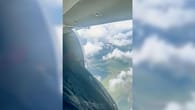 Flugzeugtür öffnet sich in großer Höhe