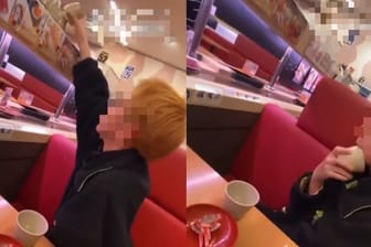 Szene aus einem Sushi-Terror-Video: Der Schüler leckt an der Tasse und stellt sie dann zurück.