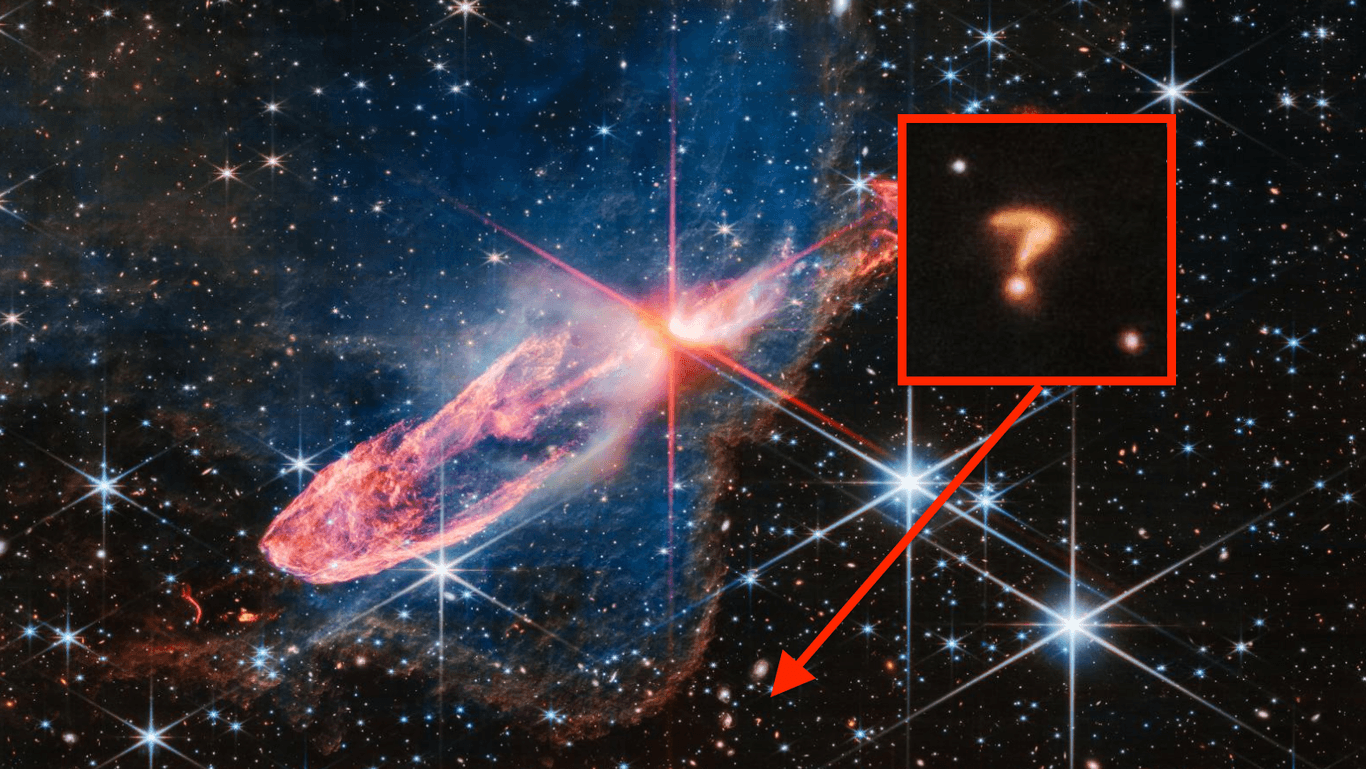 Das mysteriöse Fragezeichen: In der Mitte des Bildes sind die zwei jungen Sterne, darunter (wo der Pfeil hinzeigt) sieht man das "Fragezeichen".