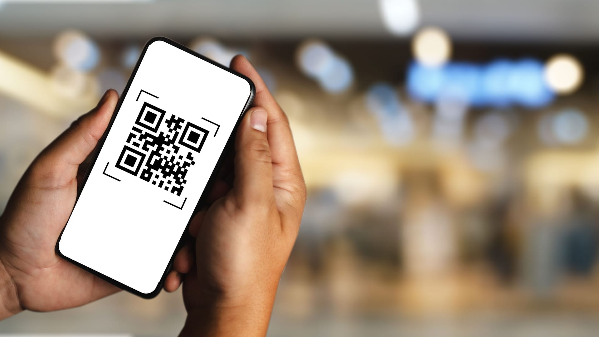 scanning QR codes with a mobile phone application and paying for goods and services in the retail supermarket background scanning QR codes with a mobile phone application and paying for goods and services in the retail supermarket background