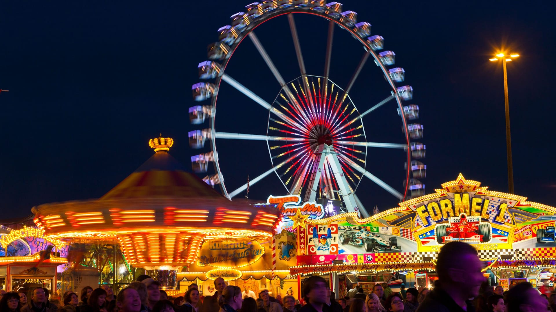 Das beleuchtete Riesenrad auf dem Bremer Freimarkt (Archivbild): Am Freitag startet die 988. Auflage.
