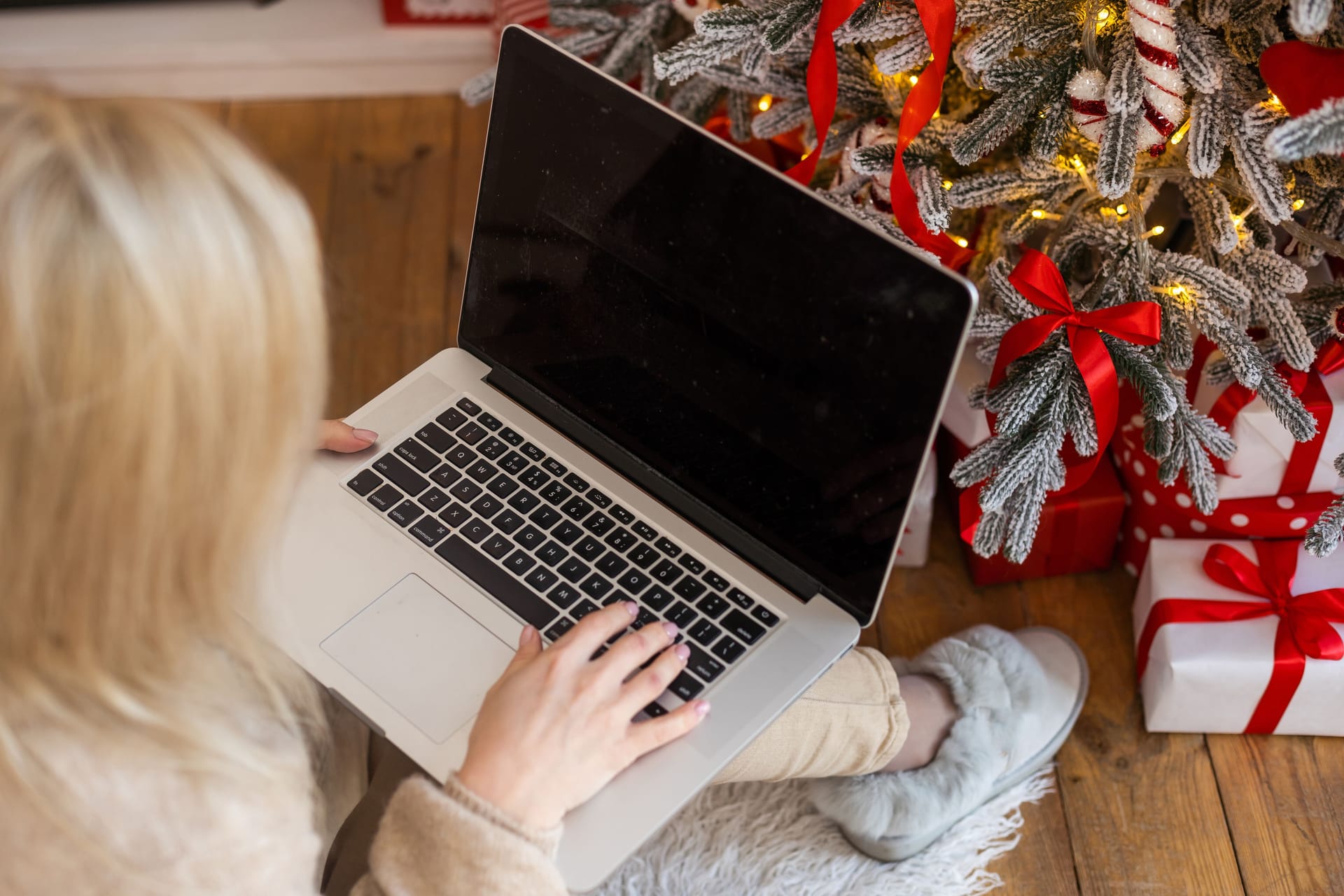 Young woman ordering Christmas gifts online