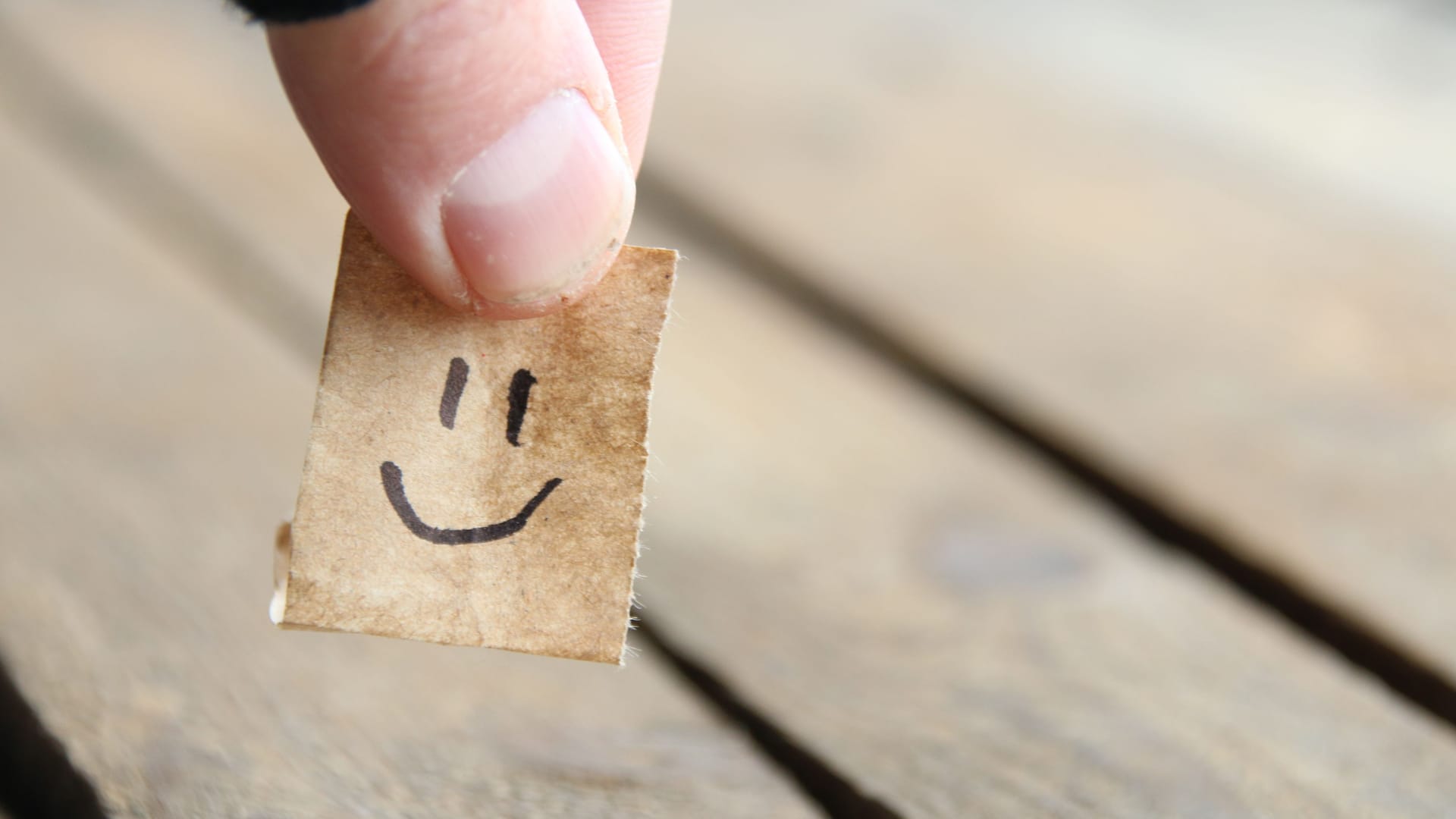 Smiley face on wooden background, copy space. Smiley face on wooden background, copy space.