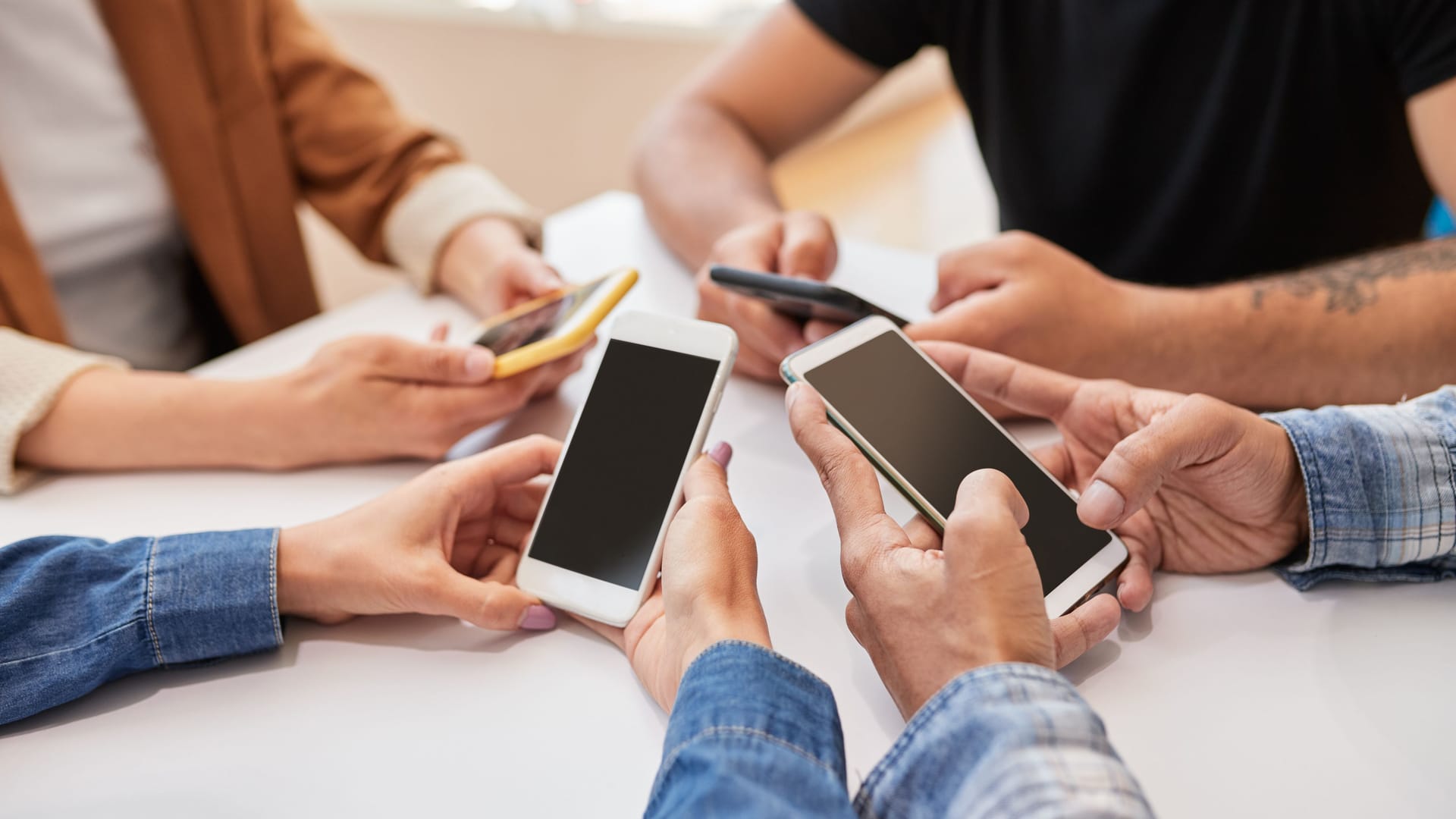 Crop friends using smartphones together