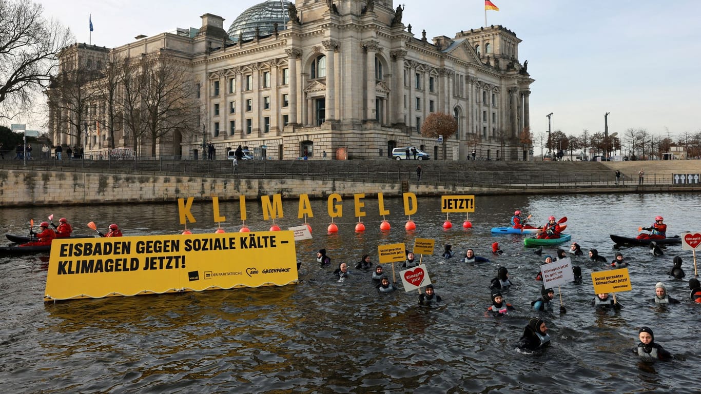 Greenpeace activists protest ahead of the final four day long debate of German lower house of parliament Bundestag about the budget for 2024 in Berlin, Germany, January 30, 2024.