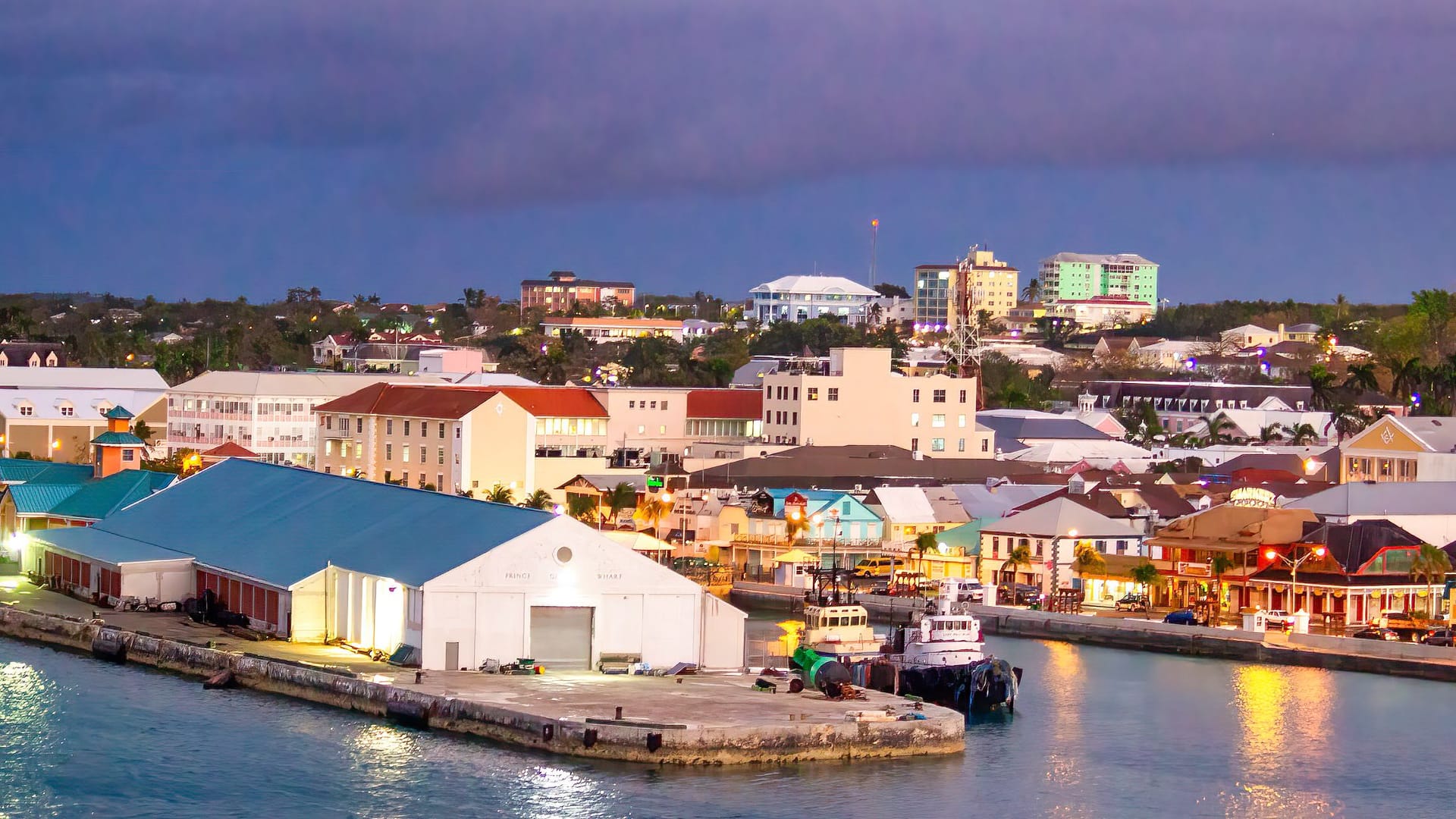 Nassau, Bahamas - February 20, 2012: Colorful city buildings along the coastline at night