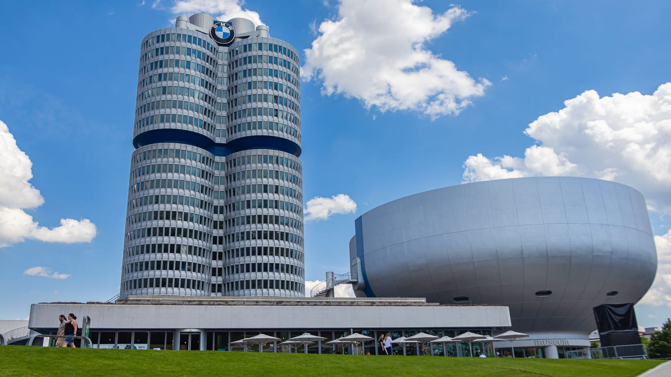 Munich, Germany - July 6, 2022: The headquarter of BMW (bayrische Motorenwerke) near the Olympic Park. The building represents a four stroke engine. Next to it is the BMW Museum, which is worth seeing