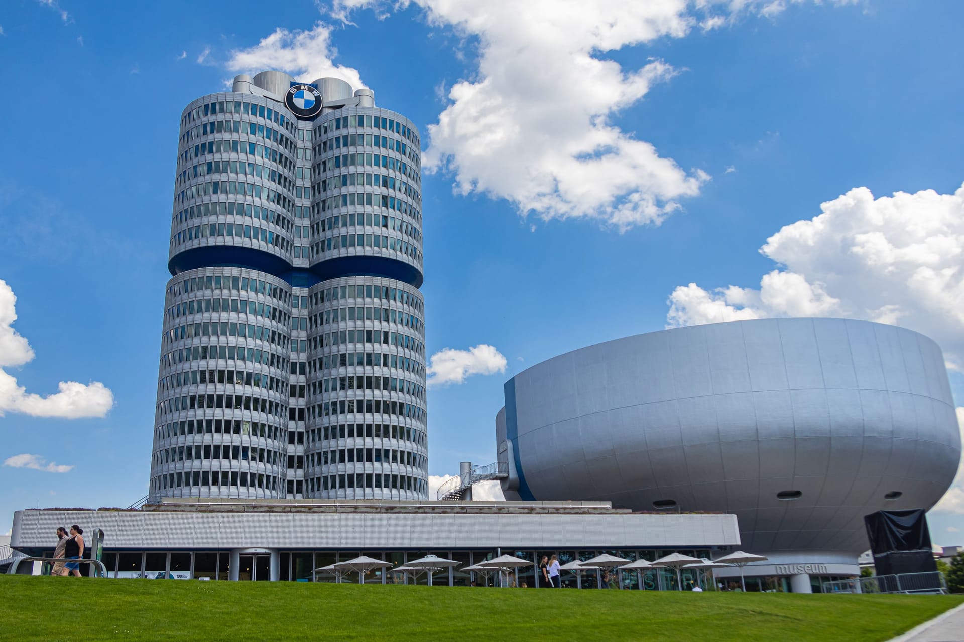 Munich, Germany - July 6, 2022: The headquarter of BMW (bayrische Motorenwerke) near the Olympic Park. The building represents a four stroke engine. Next to it is the BMW Museum, which is worth seeing