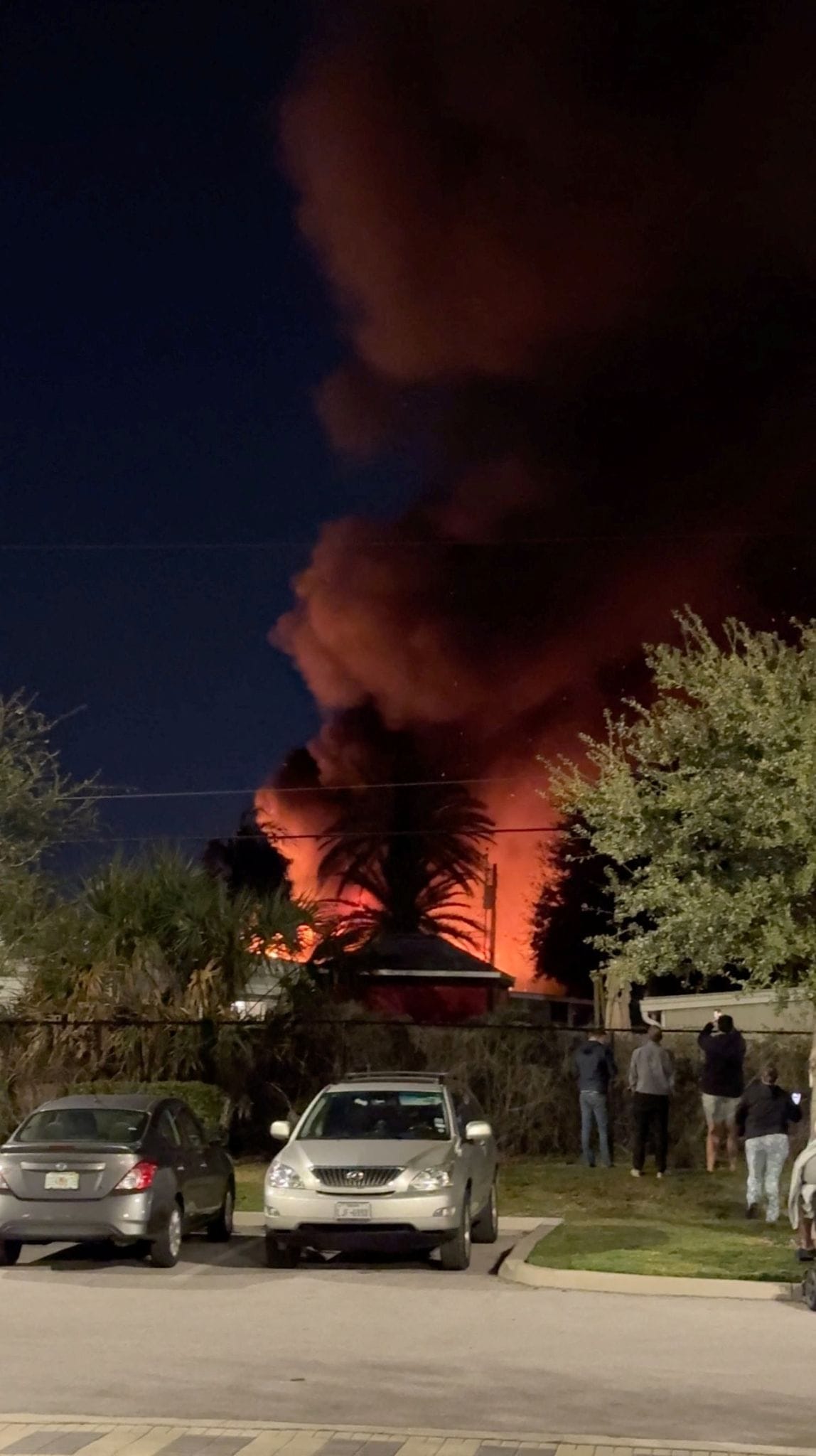 A plume of smoke rises after a small plane crashes in a trailer park in Clearwater, Florida