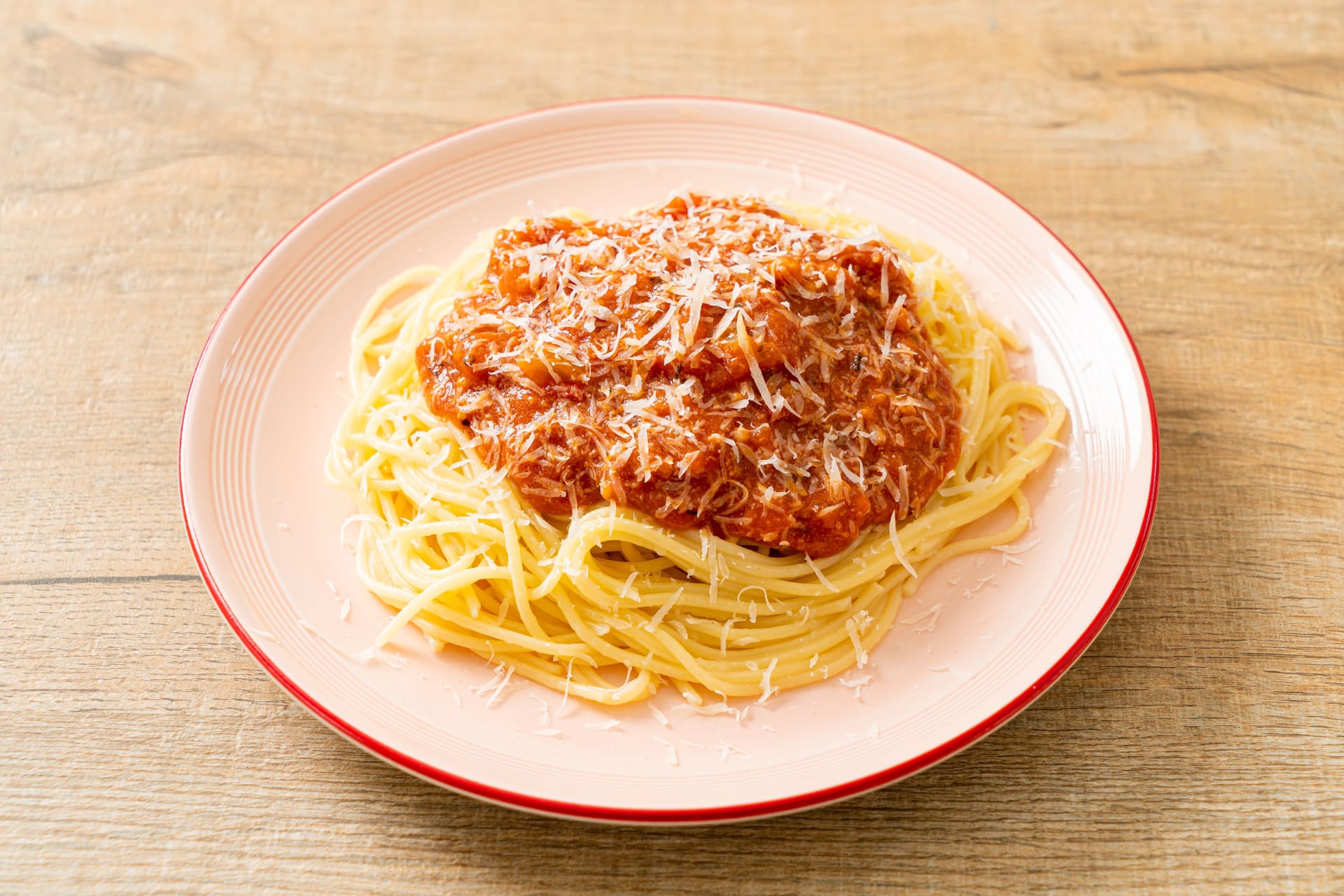 pork bolognese spaghetti with parmesan cheese