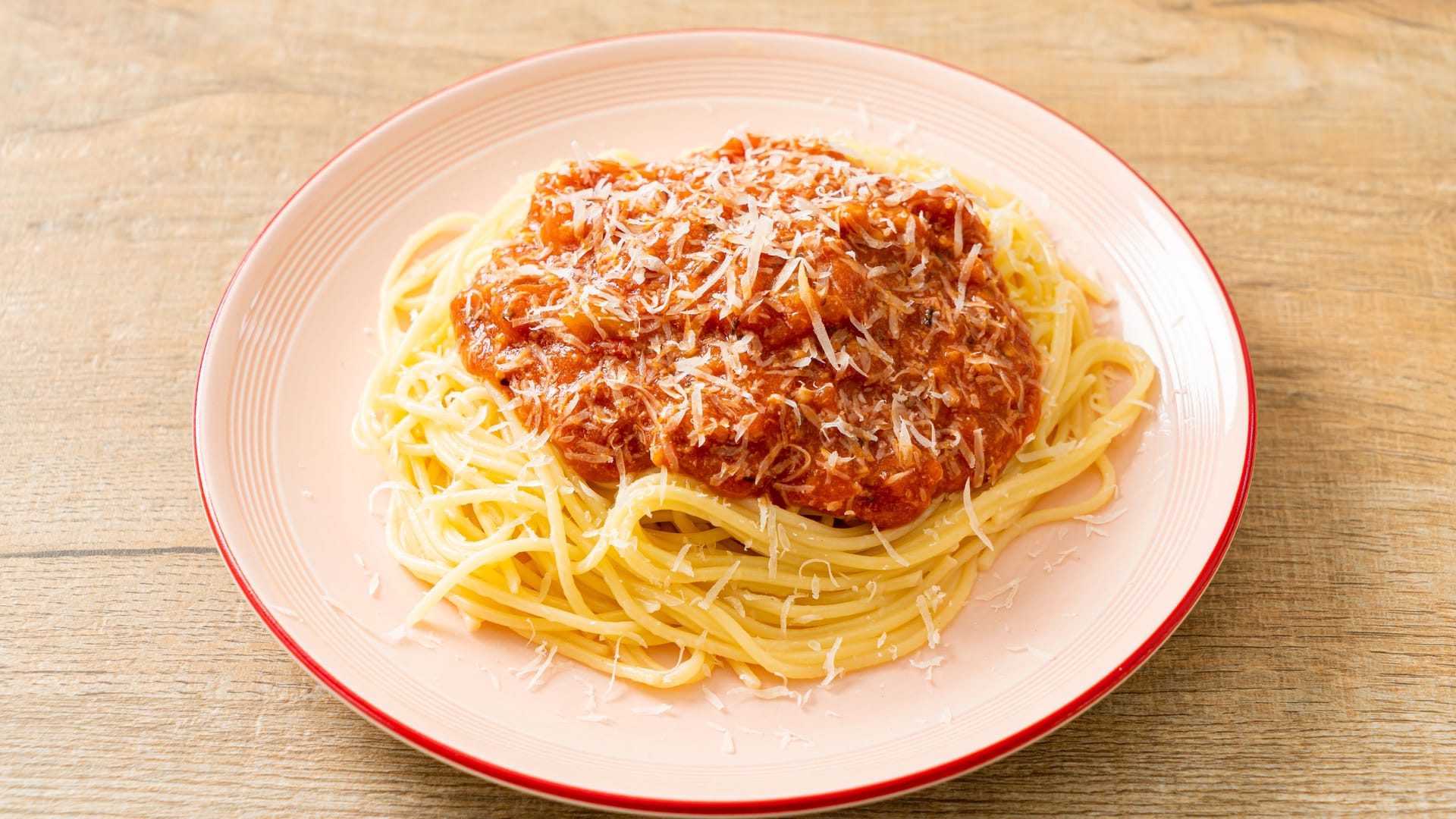 pork bolognese spaghetti with parmesan cheese