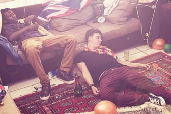 They partied until they passed out. Three guys passed out after a party.