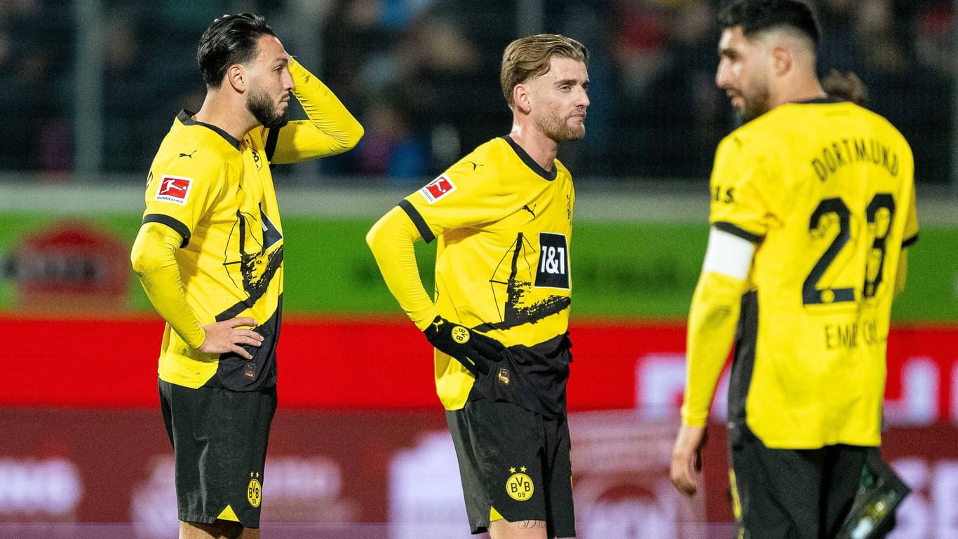 Enttäuscht: Dortmunds Can (li.) und Pohlmann im Spiel in Heidenheim.