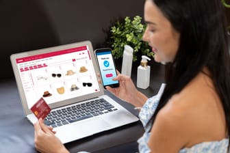 Young woman order or purchase product on internet using laptop. Blithe