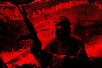 Die Shilouette eines ISIS-Terroristen vor der Flagge des Islamischen Staates (Illustration).
