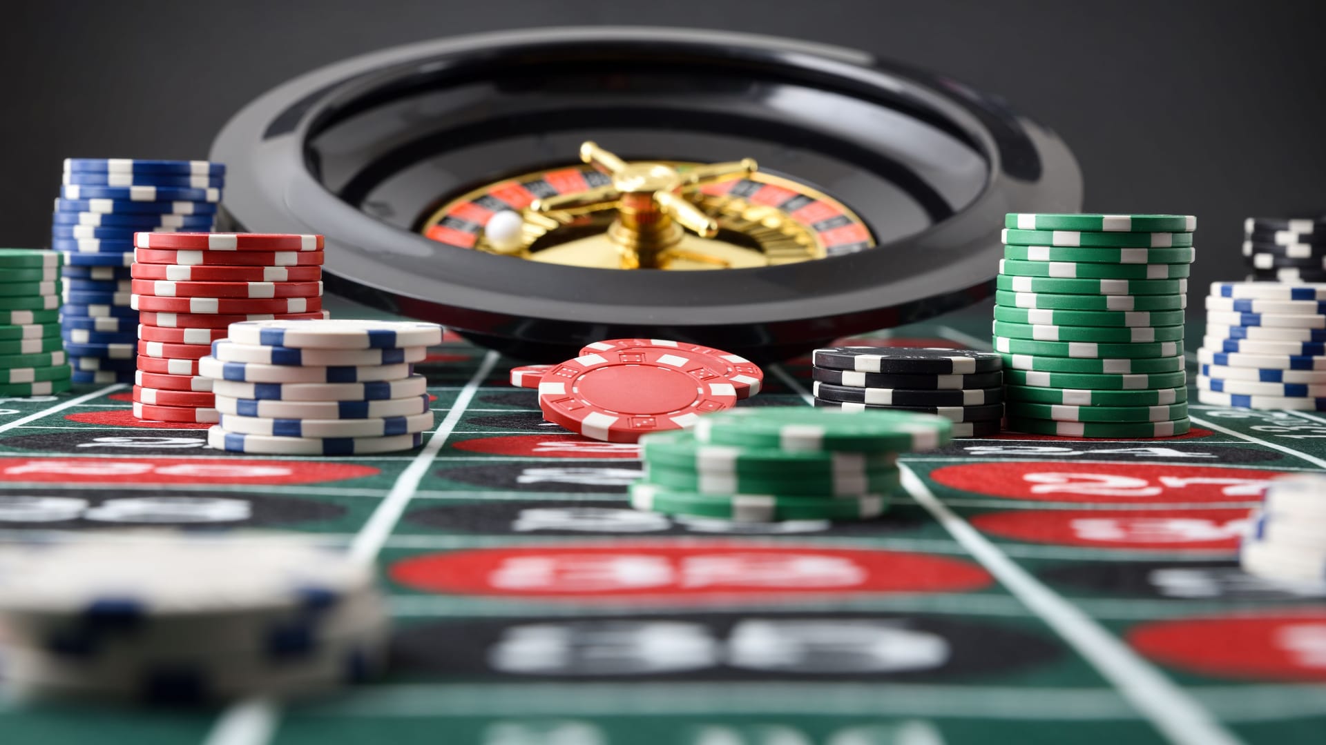 Roulette game table with chips with isolated black background Roulette game table with chips with isolated black background