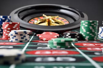 Roulette game table with chips with isolated black background