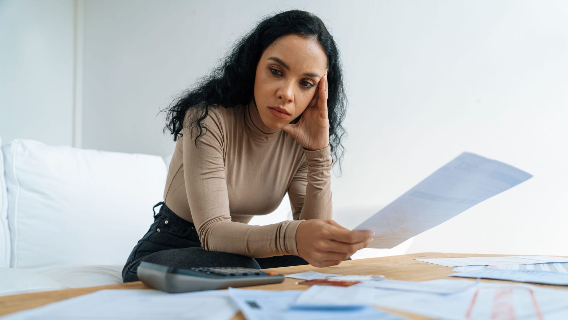 Stressed young woman has financial problems credit card debt to pay crucial