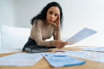 Stressed young woman has financial problems credit card debt to pay crucial