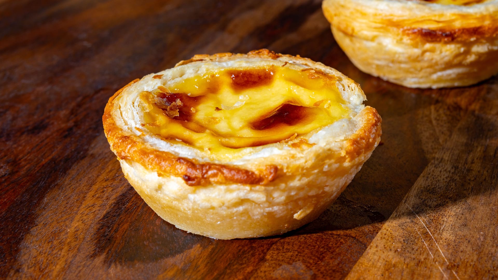Portugal's traditional sweet dessert Pastel de nata egg custard tart pastry in cup
