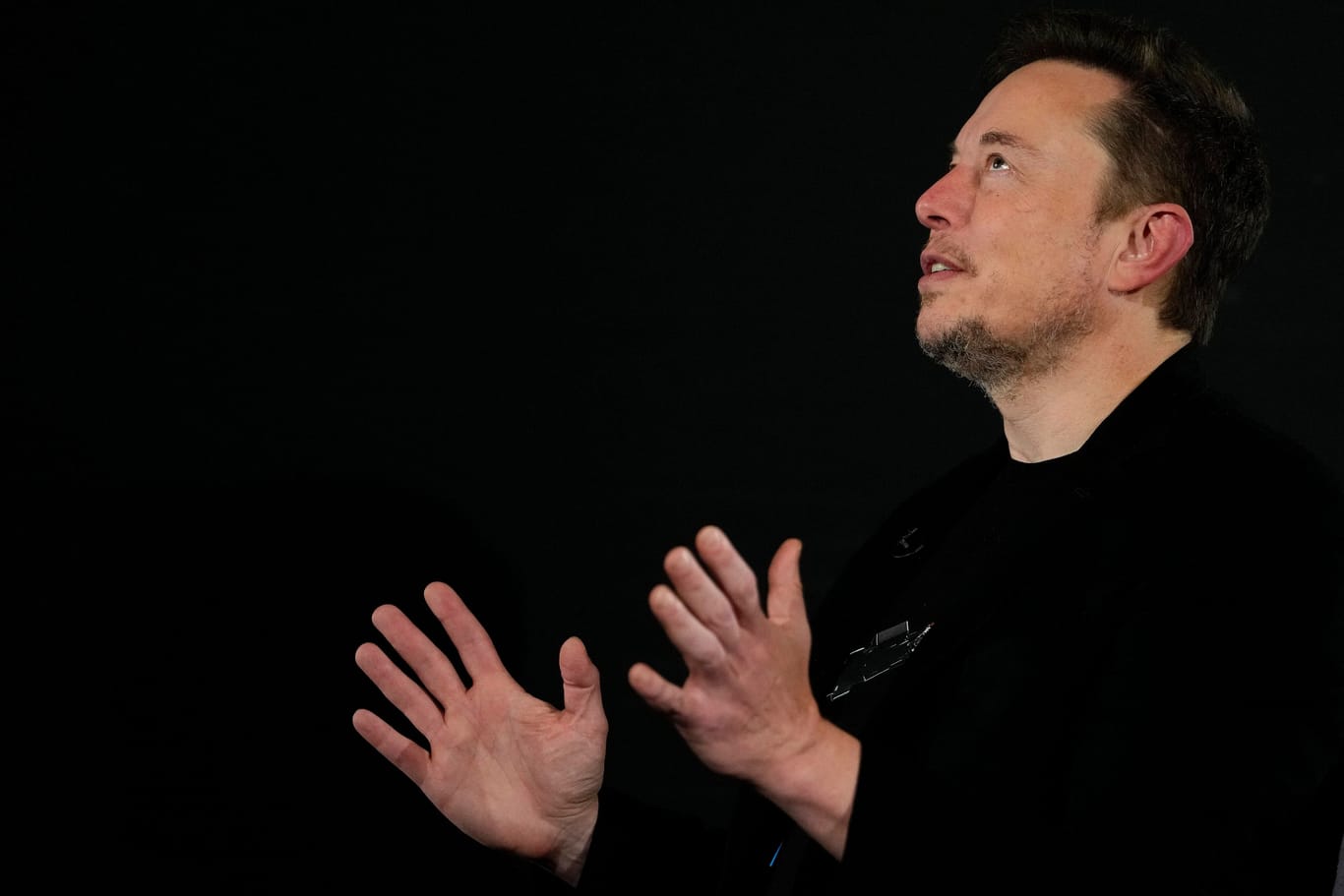 Tesla and SpaceX s CEO Elon Musk gestures during an in-conversation event with Britain s Prime Minister Rishi Sunak in London, Thursday, Nov. 2, 2023. Sunak discussed AI with Elon Musk in a conversation that is played on the social network X, which Musk o Tesla and SpaceX s CEO Elon Musk gestures during an in-conversation event with Britain s Prime Minister Rishi Sunak in London, Thursday, Nov. 2, 2023.