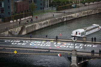 A message which activists painted on a bridge during the global Fridays for Future climate strike is pictured, in Berlin, Germany, April 19, 2024.