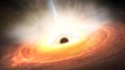 Künstlerische Darstellung eines Schwarzen Lochs im Zentrum einer Galaxie.