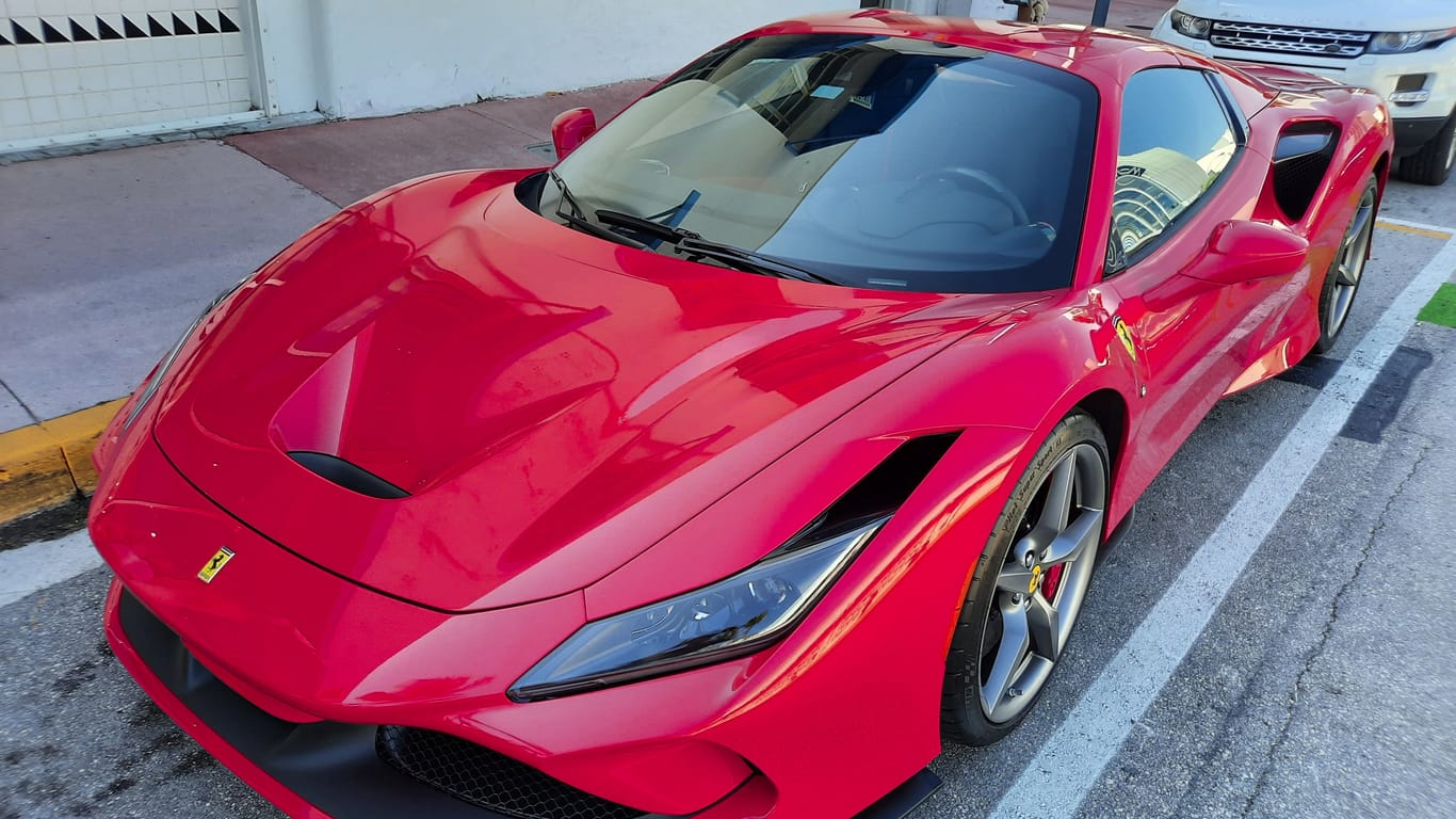 Los Angeles, California USA - March 24, 2021: red Ferrari F8 Tributo luxury car top corner view.