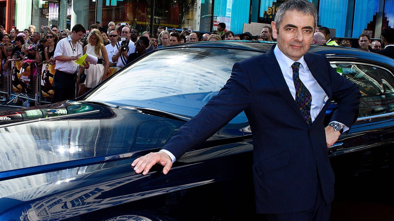 Benzin im Blut: Rowan Atkinson ("Johnny Englisch") gibt viel Geld für Autos aus – manchmal verdient er damit aber auch viel Geld.