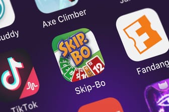 London, United Kingdom - September 30, 2018: Close-up shot of the Skip-Bo™ application icon from Magmic Inc. on an iPhone., London, United Kingdom - September 30, 2018: Close-up shot of the Skip-Bo™ application icon from Magmic Inc. on an iPhone.