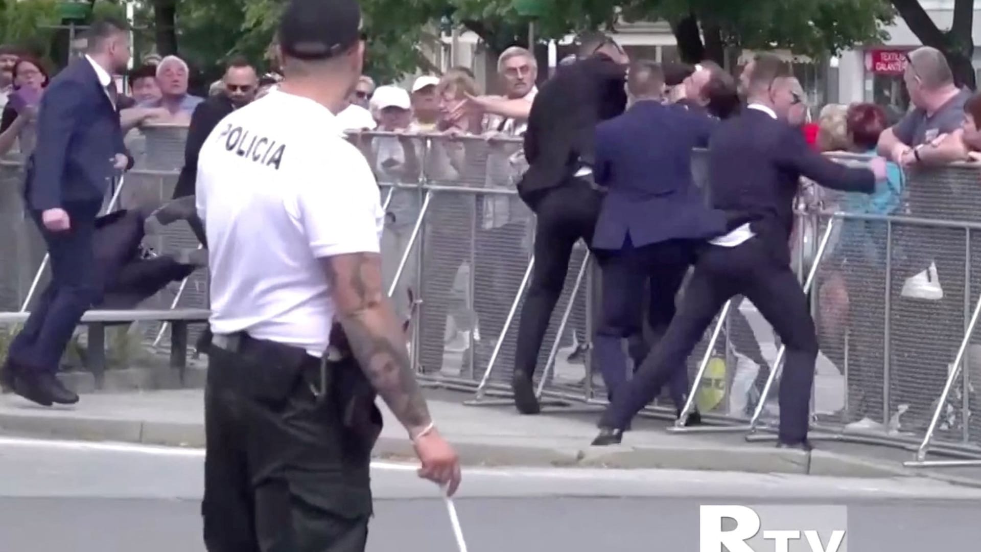 Members of Slovakia's Prime Minister Robert Fico's security detain a man during a shooting incident in this screen grab from a video