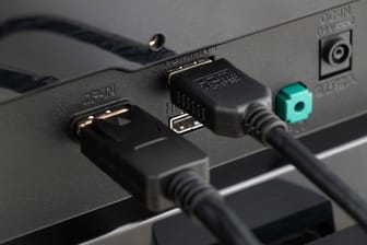 Close up of DisplayPort cable and HDMI cable connected to device