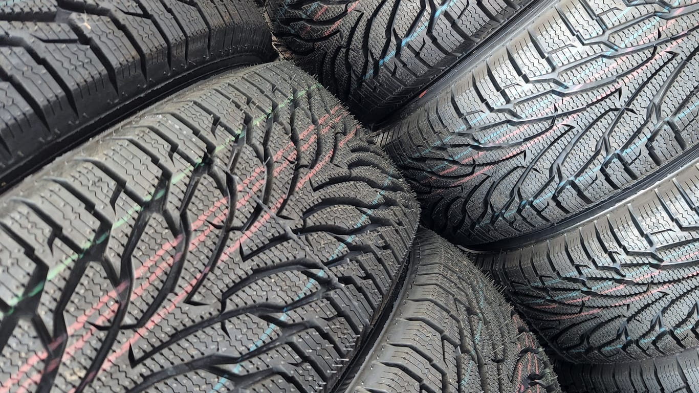 Car tires. Car tire warehouse. Shelf with new car tires