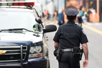 NEW YORK, USA - June 10, 2018: Police officer performing his duties on the streets of Manhattan. New York City Police Department (NYPD).