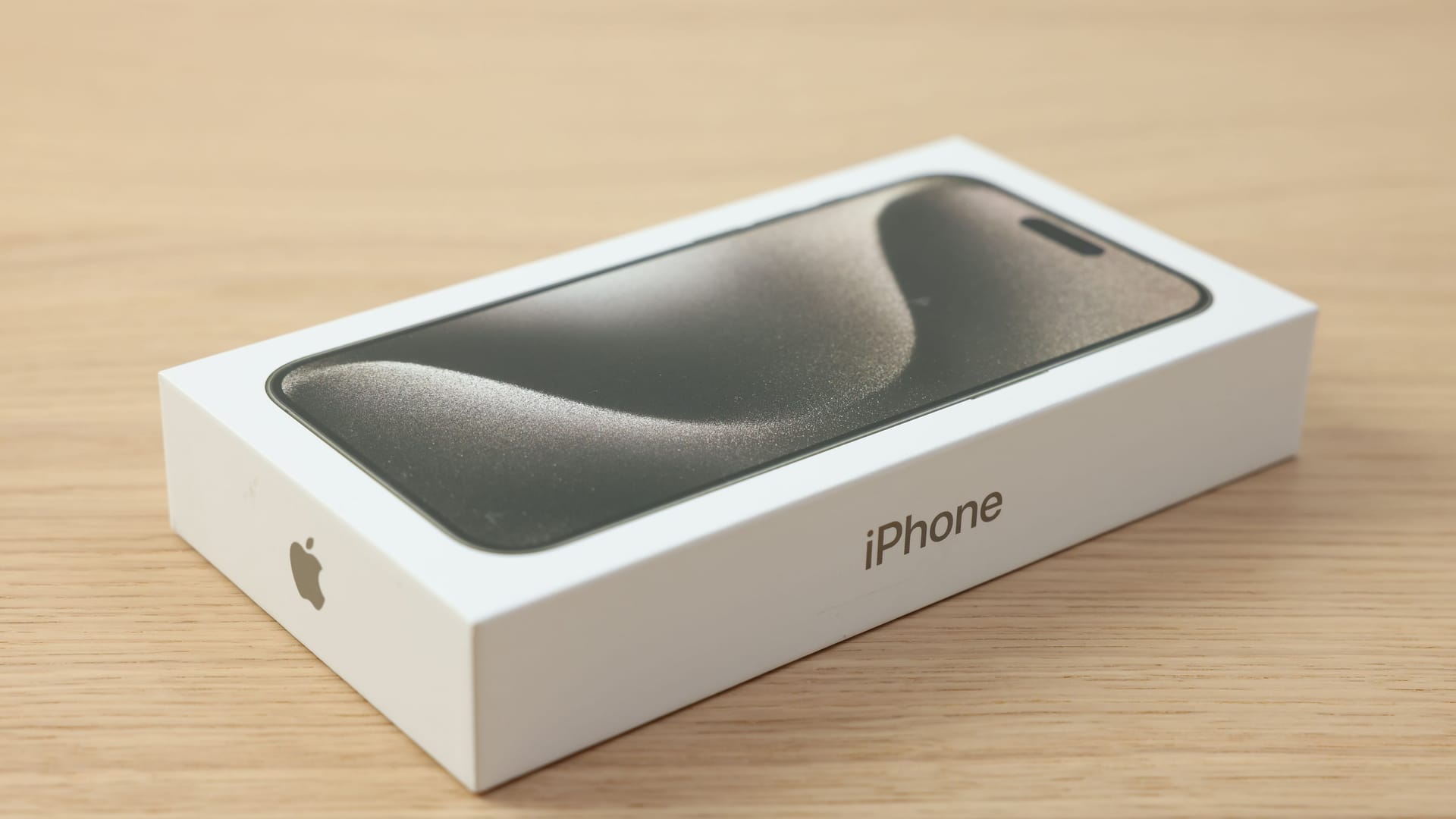 Leiden, Netherlands - October 6, 2023: Box with iPhone 15 Pro Max on wooden table