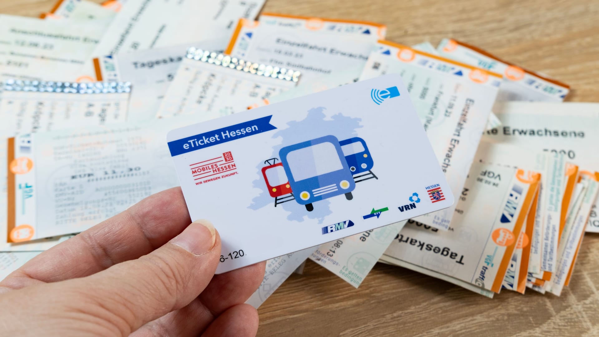 female hand holds electronic eTicket Germany, plastic monthly travel card, Digital Transformation in Transit, Public Transportation Technology, Frankfurt - December 3, 2023