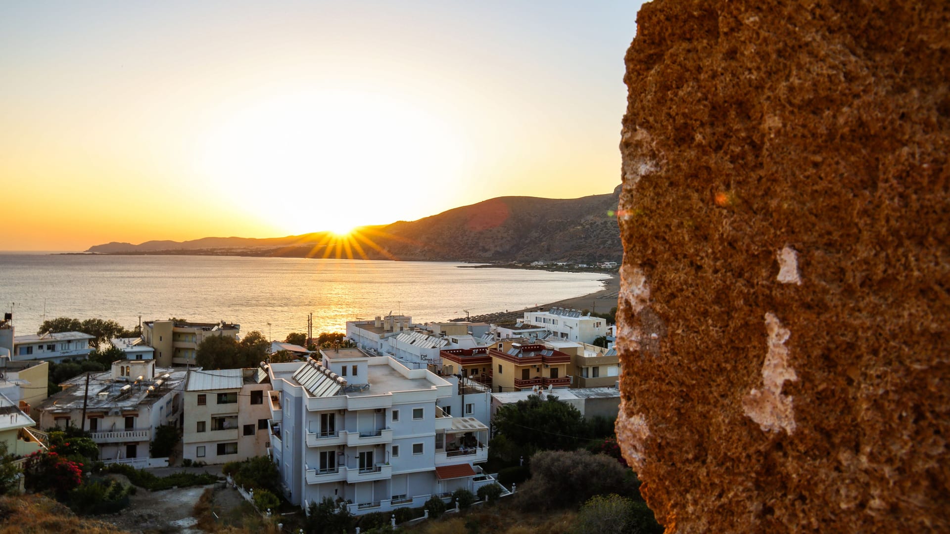 scenic view of sunset and beach of paleochora old town, crete