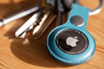 LONDON, UK - January 2021: Apple air tag device that helps people keep track of personal items