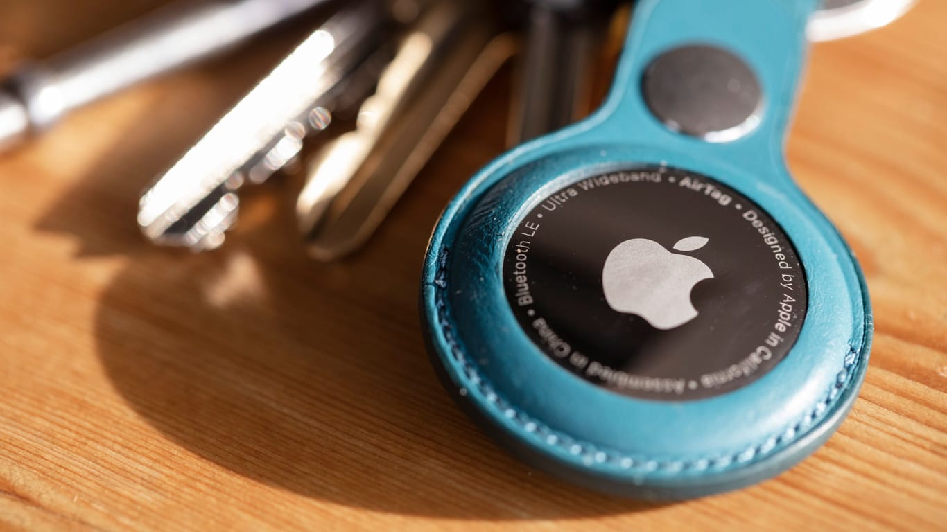LONDON, UK - January 2021: Apple air tag device that helps people keep track of personal items