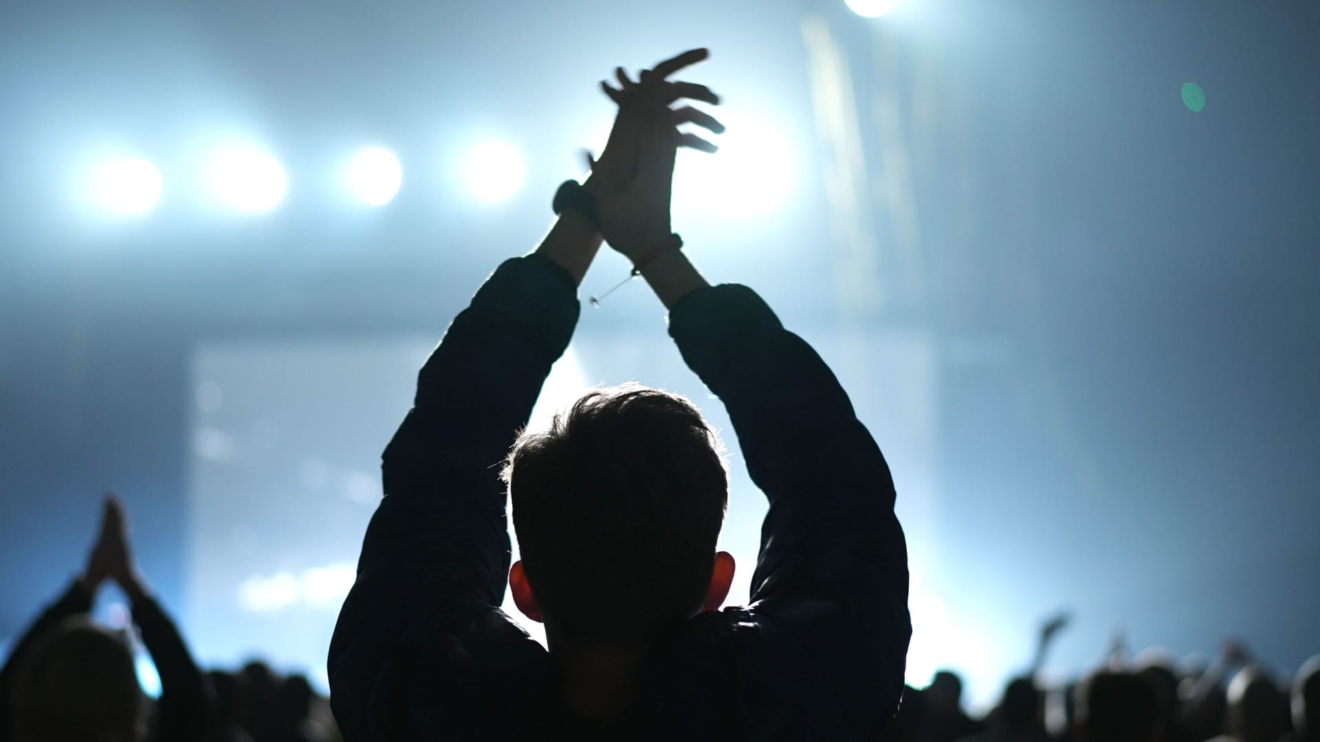 Cheerful man applauding at concert. Kpop fan clap. Fun music party. Cheering guy