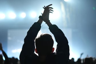 Cheerful man applauding at concert. Kpop fan clap. Fun music party. Cheering guy