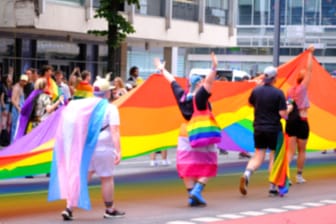 march LGBTQ community, mass march of lesbian, gay people, bisexual, transgender with rainbow flags, Gay pride parade in city with rainbow flags, against discrimination on queer people