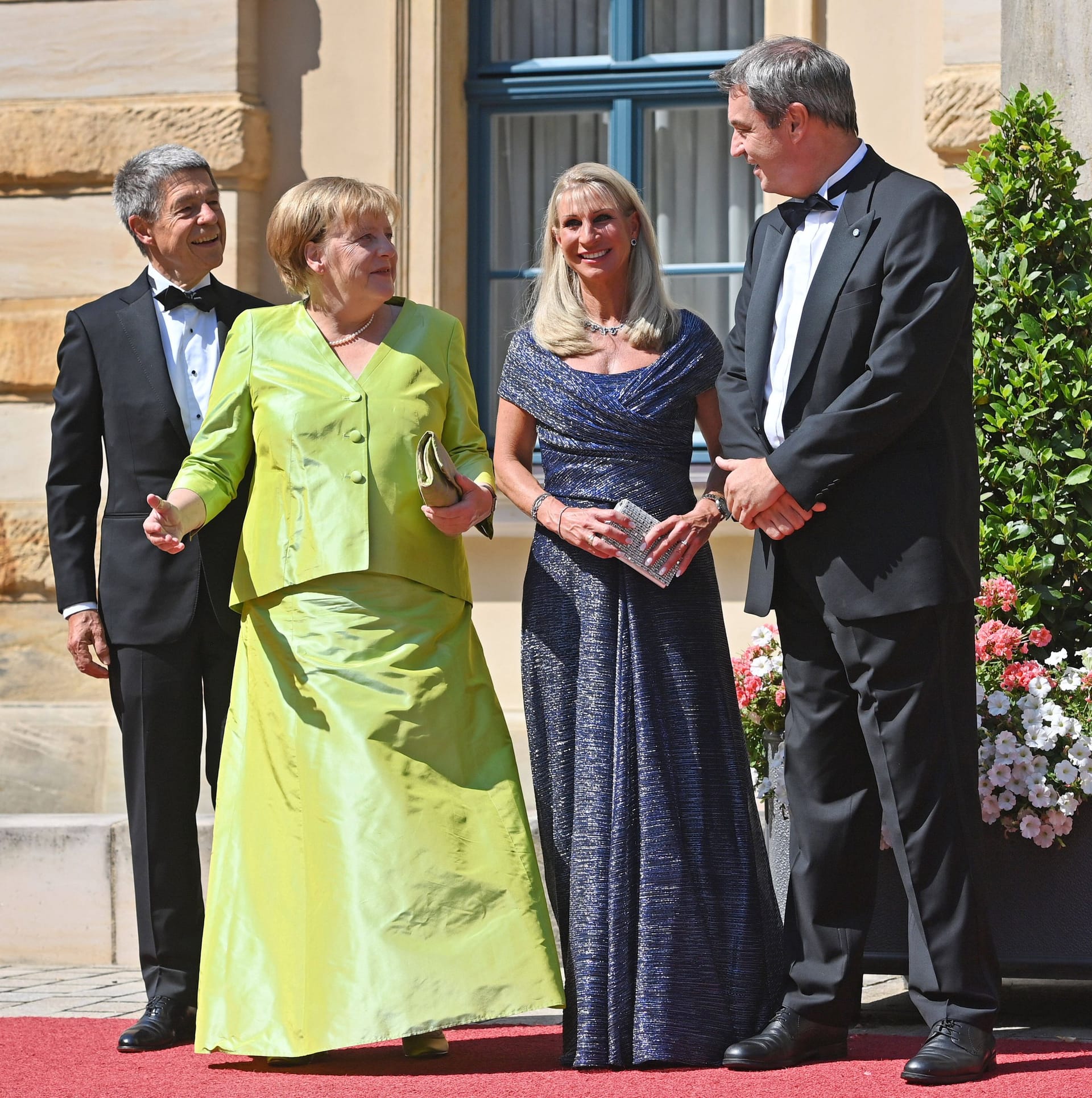 Joachim Sauer, Angela Merkel, Karin Baumüller-Söder und Markus Söder bei den Festspielen 2022.