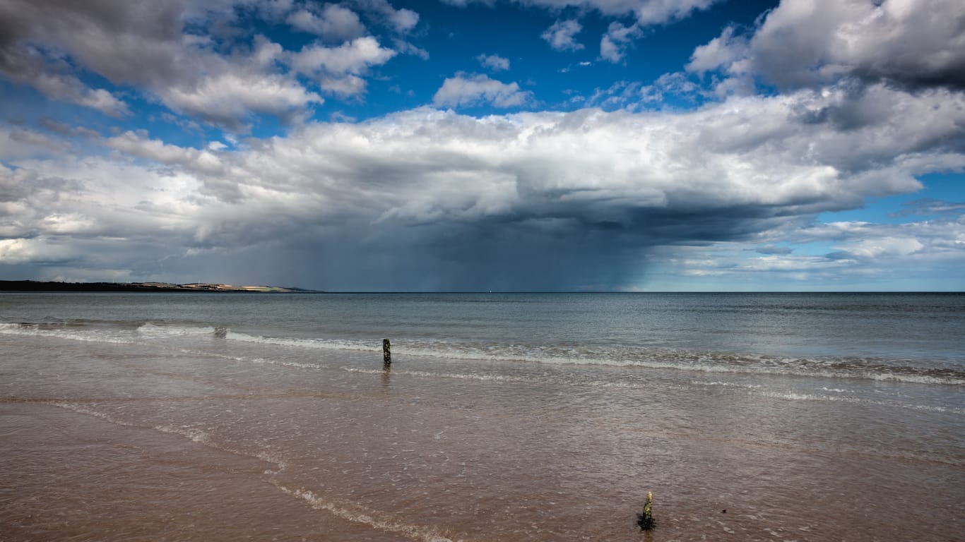 On the empty beach in Montrose before storm, Scotland