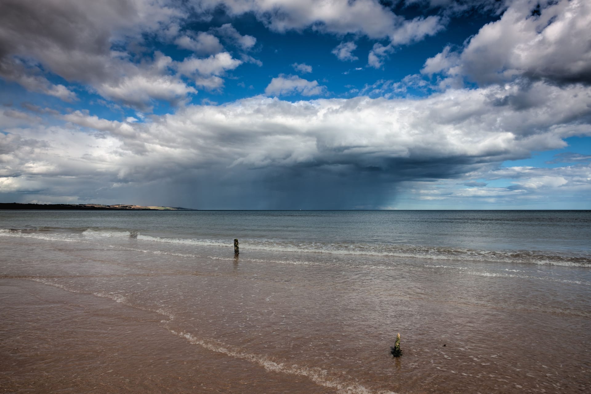 On the empty beach in Montrose before storm, Scotland