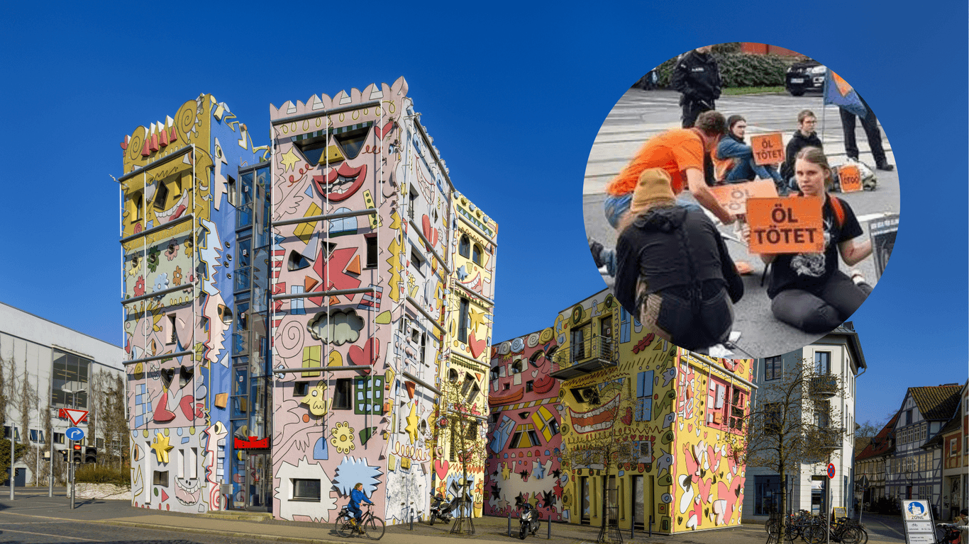 "Öl tötet" steht auf den Plakaten, mit denen Mitglieder der "Letzten Generation" vor dem Rizzi-Haus in Braunschweig demonstriert haben.