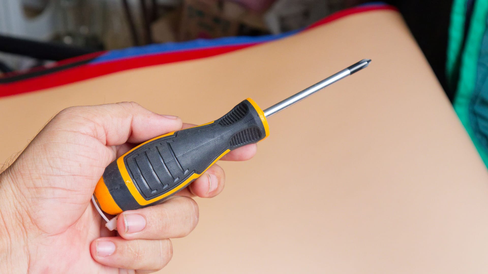 Man Holding Screwdriver - DIY Home Improvement Man Holding Screwdriver - DIY Home Improvement