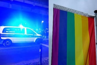 Polizeiwagen und Regenbogenflagge (Symbolbild): Am Wochenende kam es zu zwei Anfeindungen gegenüber queeren Menschen.